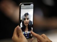 The new iPhone X is displayed in the showroom after the new product announcement at the Steve Jobs Theater on the new Apple campus on Tuesday, Sept. 12, 2017, in Cupertino, Calif. (AP Photo/Marcio Jose Sanchez)