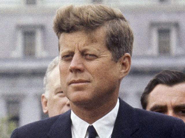 FILE - In this April 30, 1963 file photo, President John F. Kennedy listens while Grand Duchess Charlotte of Luxembourg speaks outside the White House in Washington. The National Archives has until Oct. 26, 2017, to disclose the remaining files related to Kennedy's Nov. 22, 1963 assassination, unless President Donald Trump intervenes. (AP Photo/William J. Smith, File)