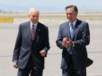 FILE - In this June 8, 2012 file photo, Republican presidential candidate, former Massachusetts Gov. Mitt Romney, right, laughs walking side-by-side with Sen. Orrin Hatch, R-Utah, who met him on the tarmac at Salt Lake International Airport, in Salt Lake City. Local television stations recorded the moment, reminding the states GOP voters that their favorite politician, Romney, was in Hatch's corner. (AP Photo/Colin E. Braley, File)