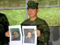 In this photo released by the 4th Civil Relations Group, Civil Relations Service Armed Forces of the Philippines, Philippine military chief Gen. Eduardo Ano holds pictures of dead militant leaders during a press conference at a military camp in Marawi, southern Philippines on Monday, Oct. 16, 2017. The last two surviving leaders of a deadly siege in the southern Philippines, including a top Asian terror suspect, were killed Monday in a push by thousands of troops to retake the last pocket of Marawi city still held by pro-Islamic State militants, top security officials said. Officials said that Isnilon Hapilon, who is listed among the FBI's most-wanted terror suspects, and Omarkhayam Maute were killed in a gunbattle and their bodies were found Monday in Marawi. (4th Civil Relations Group, Civil Relations Service Armed Forces of the Philippines via AP)