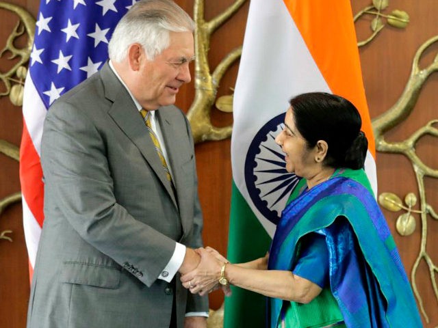 Indian Foreign Minister Sushma Swaraj, right, shakes hand with U.S. Secretary of State Rex Tillerson in New Delhi, India, Wednesday, Oct. 25, 2017. (AP Photo/Manish Swarup)