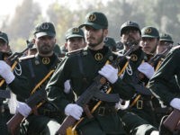 In this picture taken on Sunday, Sept. 21, 2008, Iranian Revolutionary Guards members march during a parade ceremony, marking the 28th anniversary of the onset of the Iran-Iraq war (1980-1988), in front of the mausoleum of the late revolutionary founder Ayatollah Ruhollah Khomeini, just outside Tehran, Iran. Speaking to Arab students at Carnegie Mellon's Doha campus, US Secretary of State Hillary Rodham Clinton said Monday, Iran's Revolutionary Guard Corps appears to have gained so much power that it effectively is supplanting the Iranian government. (AP Photo/Vahid Salemi)