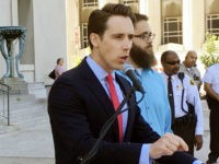 In this June 21, 2017 file photo, Missouri Attorney General Josh Hawley speaks at a news conference in St. Louis. Missouri Democrats recently launched digital ads accusing potential Republican U.S. Senate candidate Josh Hawley of being financially irresponsible as attorney general, Friday, Aug. 11, 2017. (AP Photo/Jim Salter, File)