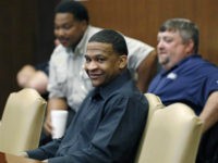 Quinton Tellis, 29, who is charged with burning 19-year-old Jessica Chambers, to death almost three years ago, smiles in a Batesville, Miss., courtroom, Monday, Oct. 16, 2017, while the jury deliberates his fate.