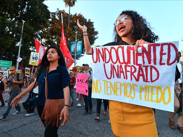 Young immigrants, activists and supporters of the DACA program march through downtown Los Angeles, California on September 5, 2017 after the Trump administration formally announced it will end the DACA (Deferred Action for Childhood Arrivals) program, giving Congress six months to act. US President Donald Trump ended an amnesty protecting 800,000 people brought to the US illegally as minors from deportation. 'I am here today to announce that the program known as DACA that was effectuated under the Obama Administration is being rescinded,' US Attorney General Jeff Sessions announced. / AFP PHOTO / FREDERIC J. BROWN (Photo credit should read FREDERIC J. BROWN/AFP/Getty Images)