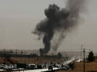 Smoke rises while Iraqi security forces use bombs as Kurdish security forces withdraw from a checkpoint in Altun Kupri, outskirts of Irbil, Iraq, Friday Oct. 20, 2017. Iraqi federal and Kurdish forces exchanged fire at their shared border on Friday, capping a dramatic week of maneuvers that saw the Kurds hand over territory across northern Iraq. (AP Photo/Khalid Mohammed)
