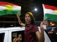 Iraqi Kurds wave the Kurdish flag as they celebrate the independence referendum in the streets of the northern city of Arbil on September 27, 2017 in Iraq's autonomous northern Kurdish region. Official results showed 92.73 percent of voters backing statehood in Monday's non-binding referendum, which Iraq's central government rejected as illegal. Turnout was put at 72.61 percent. / AFP PHOTO / SAFIN HAMED (Photo credit should read SAFIN HAMED/AFP/Getty Images)