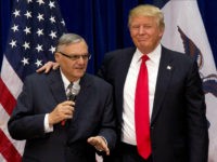 FILE - In this Jan. 26, 2016 file photo, then-Republican presidential candidate Donald Trump is joined by Joe Arpaio, the sheriff of metro Phoenix, at a campaign event in Marshalltown, Iowa. President Donald Trump has pardoned former sheriff Joe Arpaio following his conviction for intentionally disobeying a judge's order in an immigration case. The White House announced the move Friday night, Aug. 25, 2017, saying the 85-year-old ex-sheriff of Arizona's Maricopa County was a "worthy candidate" for a presidential pardon. (AP Photo/Mary Altaffer, File)