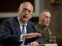 Defense Secretary Jim Mattis, left, accompanied by Joint Chiefs Chairman Gen. Joseph Dunford, speaks on Afghanistan before the Senate Armed Services Committee on Capitol Hill in Washington, Tuesday, Oct. 3, 2017. (AP Photo/Andrew Harnik)