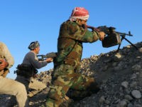 Peshmerga fighters take aim from their position at the Altun Kubri checkpoint, 40kms from Kirkuk, on October 20, 2017. Iraqi forces clashed with Kurdish fighters as the central government said it wrestled back control of the last area of disputed Kirkuk province in the latest stage of a lightning operation following a controversial independence vote. / AFP PHOTO / Marc-Antoine Pelaez (Photo credit should read MARC-ANTOINE PELAEZ/AFP/Getty Images)