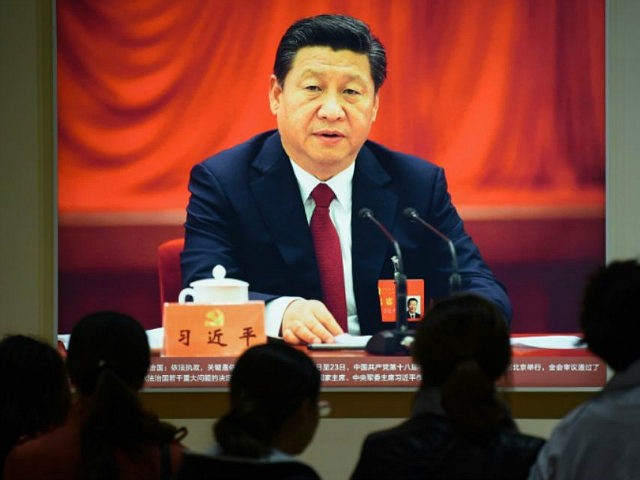 This picture taken on October 10, 2017 shows a portrait of Chinese President Xi Jinping at an exhibition showcasing China's progress in the past five years at the Beijing Exhibition Center. China's police and censorship organs have kicked into high gear to ensure that the party's week-long, twice-a-decade congress goes smoothly when it begins on October 18. / AFP PHOTO / WANG ZHAO / TO GO WITH CHINA-POLITICS-SECURITY, FOCUS BY BECKY DAVIS (Photo credit should read WANG ZHAO/AFP/Getty Images)