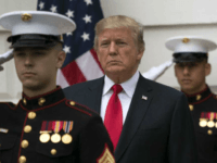President Donald Trump stands behind and in front of members of a Marine honor guard as he greets Canadian Prime Minister Justin Trudeau and Sophie Gregoire Trudeau as they arrive at the White House in Washington, Wednesday, Oct. 11, 2017. (AP Photo/Carolyn Kaster)