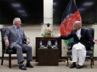 US Secretary of State Rex Tillerson (L) speaks with Afghan President Ashraf Ghani before their meeting at Bagram Air Field in Afghanistan on October 23, 2017