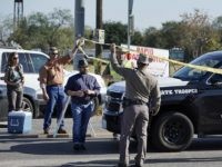 Law enforcement officers man a barricade near the First Baptist Church of Sutherland Springs after a fatal shooting, Sunday, Nov. 5, 2017, in Sutherland Springs, Texas. (AP Photo/Darren Abate)