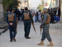 Afghan security forces stand guard near the site of a suicide attack in Jalalabad on November 23, 2017. A suicide bomber struck at a crowd of people in the eastern Afghan province of Nangarhar on November 23 killing at least eight, officials said, in an attack that underscored worsening security. The bomber approached the crowd of dozens on foot in provincial capital Jalalabad as they were demonstrating in support of a local police commander who had been sacked and calling for his reinstatement, provincial spokesman Attaullah Khogyani said. / AFP PHOTO / Noorullah SHIRZADA (Photo credit should read NOORULLAH SHIRZADA/AFP/Getty Images)