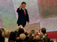 China's President Xi Jinping (C) arrives to speak on the final day of the APEC CEO Summit, part of the broader Asia-Pacific Economic Cooperation (APEC) leaders' summit, in the central Vietnamese city of Danang on November 10, 2017. World leaders and senior business figures are gathering in the Vietnamese city of Danang this week for the annual 21-member APEC summit. / AFP PHOTO / POOL / NYEIN CHAN NAING (Photo credit should read NYEIN CHAN NAING/AFP/Getty Images)