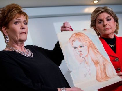 Attorney Gloria Allred (R) and Beverly Young Nelson hold up a drawing of Nelson when she was younger during a press conference on November 13, 2017, in New York, alledging that Roy Moore sexually assaulted Nelson when she was a minor in Alabama without her consent. The US Senate's top Republican on Monday urged scandal-hit conservative Roy Moore to end his Senate campaign, saying he believes the women who have accused the Christian evangelical candidate of sexual misconduct. / AFP PHOTO / EDUARDO MUNOZ ALVAREZ (Photo credit should read EDUARDO MUNOZ ALVAREZ/AFP/Getty Images)