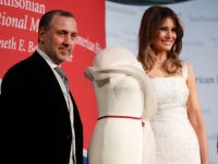 First lady Melania Trump, right, donates her inaugural gown, designed by Herve Pierre, left, to the First Ladies' Collection at the Smithsonian's National Museum of American History, during a ceremony in Washington, Friday, Oct. 20, 2017. (AP Photo/Pablo Martinez Monsivais)