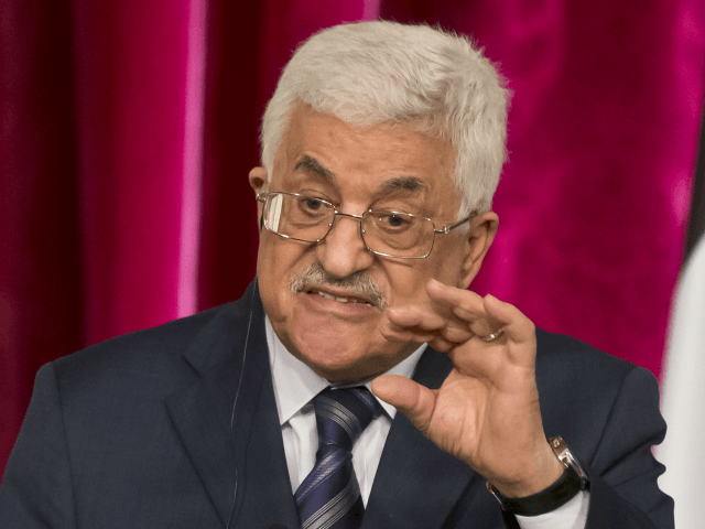 In this Sept. 19, 2014 file photo, Palestinian President Mahmoud Abbas gestures as he speaks during a media conference at the Elysee Palace in Paris. The Hamas militant group on Sunday, Sept. 7, 2017, said it has accepted key conditions demanded by its rival, President Mahmoud Abbas, including nationwide elections in the West Bank and Gaza Strip, to clear the way for a reconciliation deal after a 10-year rift that has left the Palestinians divided between two governments. (AP Photo/Michel Euler, File)