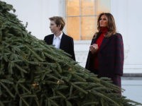 WASHINGTON, DC - NOVEMBER 20: First lady Melania Trump and her son Barron inspect the 19.5-foot balsam Fir that will serve as the official White House Christmas Tree at the White House on November 20, 2017. The tree is a Wisconsin grown Fir provided by the Chapman family of Silent Night Evergreens. (Photo by Mark Wilson/Getty Images)