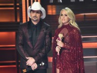 NASHVILLE, TN - NOVEMBER 08: Co-hosts Brad Paisley and Carrie Underwood speak onstage at the 51st annual CMA Awards at the Bridgestone Arena on November 8, 2017 in Nashville, Tennessee. (Photo by Rick Diamond/Getty Images)