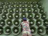 A South Korean soldier takes down a battery of propaganda loudspeakers on the border with North Korea in Paju on 16 June 2004 in Paju, South Korea. The removal of the propaganda devices along the world?s last Cold War frontier follows on from the inter-Korean summit accord which was reached in 2000. (Photo by Chung Sung-Jun/Getty Images)