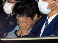 HACHIOJI, JAPAN - NOVEMBER 01: (CHINA OUT, SOUTH KOREA OUT) Suspect Takahiro Shiraishi covering his face is seen on arrival at Takao Police Station on November 1, 2017 in Hachioji, Tokyo, Japan. Shiraishi, unemployed, was arrested on October 31 on suspicion of abandoning the body of one of the nine people, eight of whom were women, after police found heads, legs and arms in storage boxes and coolers in his apartment. Police have found nine human heads and about 240 pieces of bones and other body parts in his apartment. (Photo by The Asahi Shimbun via Getty Images)
