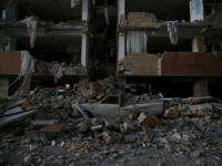 A flattened vehicle underneath building rubble is seen following a 7.3-magnitude earthquake at Sarpol-e Zahab in Iran's Kermanshah province on November 13, 2017. At least 164 people were killed and 1,600 more injured when a 7.3-magnitude earthquake shook the mountainous Iran-Iraq border triggering landslides that were hindering rescue efforts, officials said. / AFP PHOTO / ISNA / POURIA PAKIZEH (Photo credit should read POURIA PAKIZEH/AFP/Getty Images)