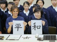 TOKYO, JAPAN - NOVEMBER 06: (CHINA OUT, SOUTH KOREA OUT) Melania Trump, wife of U.S. President Donald Trump, and Akie Abe, wife of Japanese Prime Minister Shinzo Abe show their calligraphy read 'Peace' during the visit to Kyobashi Tsukiji Elementary School on November 6, 2017 in Tokyo, Japan. Trump is on 11-day tour to Asia. (Photo by The Asahi Shimbun via Getty Images)