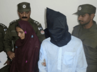 Aasia Bibi, 21, and her boyfriend, Shahid Lashari, are presented to journalists, at a police station in Muzaffargarh, Pakistan, on Monday. (Iram Asim/AP)