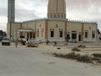 People gather at Al-Rawda Mosque in Bir al-Abd northern Sinai, Egypt a day after attackers killed hundreds of worshippers, on Saturday, Nov. 25, 2017. Friday's assault was Egypt's deadliest attack by Islamic extremists in the country's modern history, a grim milestone in a long-running fight against an insurgency led by a local affiliate of the Islamic State group.(AP Photo/Tarek Samy)
