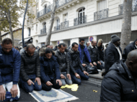 Muslims pray in the street for Friday prayer in the Paris suburb of Clichy la Garenne, Friday, Nov. 10, 2017. Tensions have erupted as residents and the mayor of a Paris suburb tried to block the town's Muslims from praying in the street in a dispute that reflects nationwide problems over mosque shortages. (AP Photo/Thibault Camus)