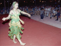Palestinian belly dancer Saida, 13, performs at the Zahret al-Mada en, or "Flower of Cities," nightclub located on the sandy beach in Gaza City in this October 1996 picture. Every weekend, young men, some with guns and cellular phones on their hips, saunter into Gaza s first and only nightclub to drink cheap Israeli whiskey and ogle sultry singers and belly dancers gyrating to Arabic love songs. But to most Gazans, the club is an eyesore - and not simply because it offends a deeply conservative society that still winces at the sight of a woman in a sleeveless blouse. (AP Photo/Adel Hana)