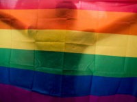 A vietnamese man dances as he holds a rainbow flag during the fourth gay pride parade on August 2, 2015 in Hanoi, Vietnam. Hundreds of demonstrators march through the streets of the Vietnamese capital urging an end to discrimination against the lesbian, gay, bisexual and transgender (LGBT) community as homosexuality remains a taboo in Vietnam. (Photo by Borja Sanchez-Trillo/Getty Images)