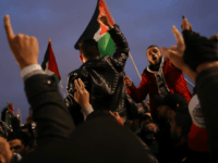BERLIN, GERMANY - DECEMBER 12: Arabic-speaking protesters attend a gathering to protest against the recent announcemment by U.S. President Donald Trump to recognize Jerusalem as the capital of Israel on December 12, 2017 in Berlin, Germany. The protesters waved Palestinian flags and chanted 'Allahu Akbar' and 'Fuck you, Donald Trump.' Today's protest was the fourth in as many days and follows a Sunday protest that drew several thousand demonstators. (Photo by Sean Gallup/Getty Images)
