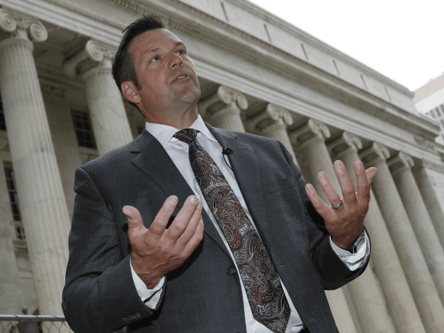 In this Aug. 23, 2016 file photo, Kansas Secretary of State Kris Kobach responds to questions outside the 10th U.S. Circuit Court of Appeals in Denver. A lawsuit by a former employee alleging that she was fired from Kobach's office because she didn't attend church enough is going to trial in federal court. While Kobach's top deputy is blamed for the firing in the lawsuit, Kobach is listed as a potential witness and answered questions from attorneys in a videotaped interview. The case also could shine an unwelcome spotlight on Kobach's staff office at the start of his campaign for governor and as he leads a presidential commission on election fraud .(AP Photo/David Zalubowski)
