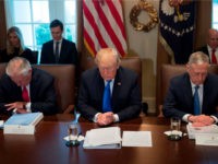 US President Donald Trump bows his head during a prayer, alongside Secretary of State Rex Tillerson (L) and Secretary of Defense Jim Mattis (R) during a Cabinet Meeting in the Cabinet Room at the White House in Washington, DC, December 20, 2017. / AFP PHOTO / SAUL LOEB (Photo credit should read SAUL LOEB/AFP/Getty Images)