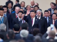 China's President Xi Jinping, centre, arrives with leaders at the opening ceremony of the CPC in dialogue with world political parties high-level meeting, at the Great Hall of the People on Friday Dec. 1, 2017. (Fred Dufour/Pool via AP)