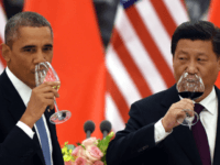 President Barack Obama and China's President Xi Jinping drink a toast at a lunch banquet in the Great Hall of the People in Beijing, Nov. 12, 2014. Presidents Obama and Xi jointly announced a landmark agreement Wednesday that includes new targets for carbon emissions reductions by the U.S. and a first-ever commitment by China to stop its emissions from growing by 2030.