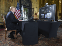 US-POLITICS-TRUMP US President Donald J. Trump participates in a video teleconference call with military members on Christmas Eve in Palm Beach, Florida on December 24, 2017. / AFP PHOTO / Nicholas Kamm (Photo credit should read NICHOLAS KAMM/AFP/Getty Images)