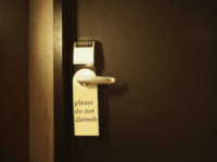 door Hotel Door with Do Not Disturb Sign, Close-Up