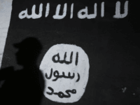 A member of the Iraqi forces walks past a mural bearing the logo of the Islamic State (IS) group in a tunnel that was reportedly used as a training centre by the jihadists, on March 1, 2017, in the village of Albu Sayf, on the southern outskirts of Mosul. Iraqi forces launched a major push on February 19 to recapture the west of Mosul from the Islamic State jihadist group, retaking the airport and then advancing north. / AFP PHOTO / AHMAD AL-RUBAYE (Photo credit should read AHMAD AL-RUBAYE/AFP/Getty Images)