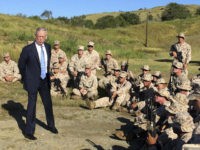 Defense Secretary Jim Mattis talks to U.S. Marine Corps troops at a rifle range at Guantanamo Bay, Cuba, on Thursday, Dec. 21. 2017. The unannounced visit was the first by a defense secretary since Donald Rumsfeld visited in January 2002 shortly after the first prisoners arrived from Afghanistan. (AP Photo/Robert Burns)