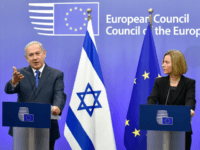 BELGIUM-EU-ISRAEL-DIPLOMACY Israel's Prime Minister Benjamin Netanyahu speaks as EU foreign policy chief, Federica Mogherini looks on during a press conference at the European Council in Brussels on December 11, 2017. Israeli Prime Minister Benjamin Netanyahu is ?holding talks on December 11 with EU foreign ministers, days after the US decision to recognise Jerusalem as Israel's capital, a move the premier had long sought but which has been met by widespread condemnation. / AFP PHOTO / JOHN THYS (Photo credit should read JOHN THYS/AFP/Getty Images)