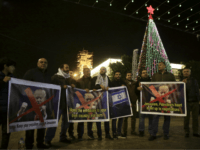 Palestinian hold posters of the U.S. President Donald Trump during a protest in Bethlehem, West Bank, Tuesday, Dec. 6, 2017. President Trump forged ahead Tuesday with plans to recognize Jerusalem as Israel's capital despite intense Arab, Muslim and European opposition to a move that would upend decades of U.S. policy and risk potentially violent protests. (AP Photo/Mahmoud Illean)