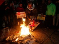 Palestinian demonstrators burn posters of the US president in Bethlehem's Manger Square in protest to him declaring Jerusalem as Israel's capital on December 6, 2017. Abbas said the United States can no longer play the role of peace broker after Donald Trump's decision on Wednesday to recognise Jerusalem as Israel's capital. / AFP PHOTO / Musa AL SHAER (Photo credit should read MUSA AL SHAER/AFP/Getty Images)