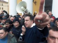 Former Georgian president Mikheil Saakashvili, center, addresses protesters after he escaped with help from supporters and led them on a march toward parliament, where they planned to call for President Petro Poroshenko to resign in Kiev, Ukraine, Tuesday, Dec. 5, 2017. Hundreds of protesters chanting "Kiev, rise up!" blocked Ukrainian police as they tried to arrest former Georgian president Mikheil Saakashvili on Tuesday. Evgeniy Maloletka - AP Photo