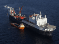 The Solitaire ship, that lays down an underwater natural gas pipeline in Finnish gulf, 200 km. (125 miles) west of St.Petersburg during Russian premier Vladimir Putin's visit to the ship, Russia, Monday, Sept. 20, 2010. The pipeline will link Russia's Baltic coast with that of Germany bypassing transit countries. (AP Photo/Dmitry Lovetsky, Pool)