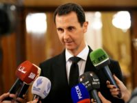 A handout picture released by the Syrian Arab News Agency on December 18, 2017 shows Syrian President Bashar al-Assad speaking to the press after receiving a Russian delegation in Damascus