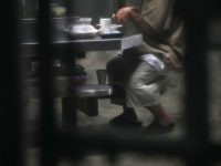 A prisoner prepares to eat lunch at the 'Gitmo' maximum security detention center on October 22, 2016 at the U.S. Naval Station at Guantanamo Bay, Cuba. The U.S. military's Joint Task Force Guantanamo is still holding 60 detainees at the prison, down from a previous total of 780. On his second day in office in 2008 President Obama issued an executive order to close the prison, which has failed because of political opposition in the U.S. (Photo by John Moore/Getty Images)